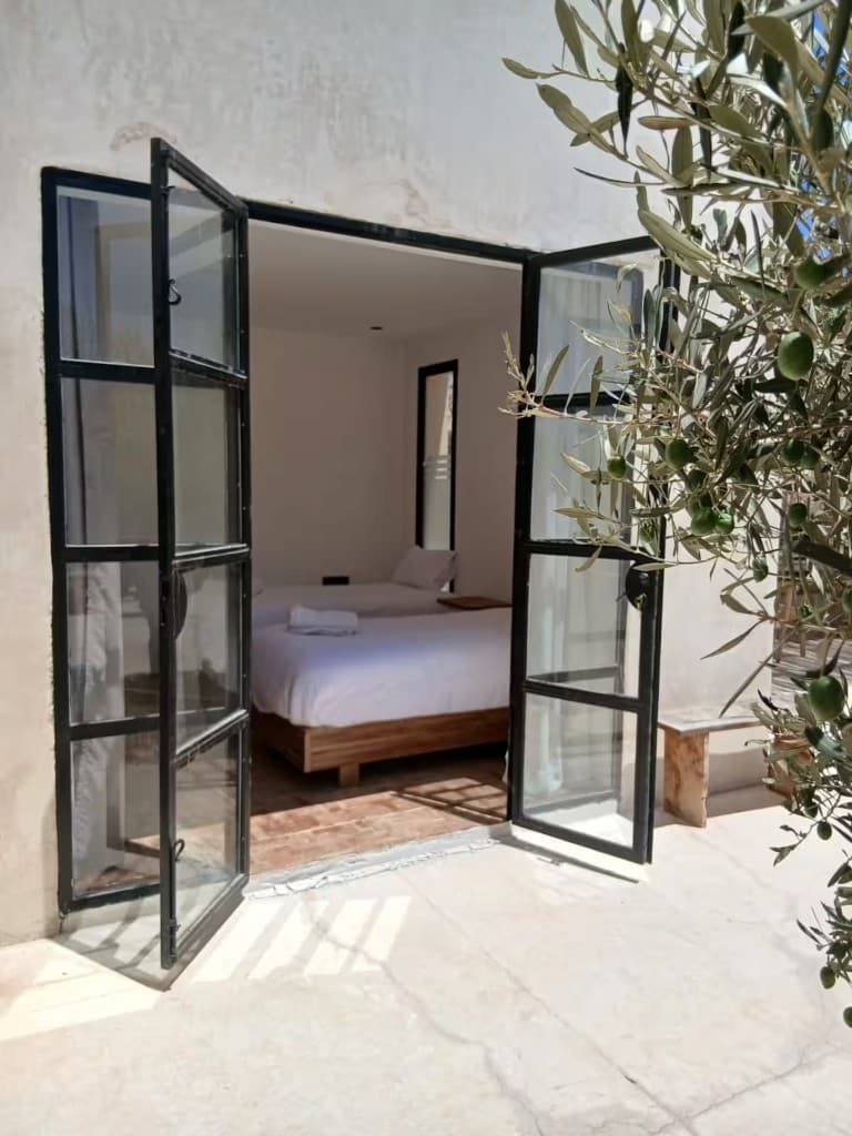 Bedroom opening to olive trees