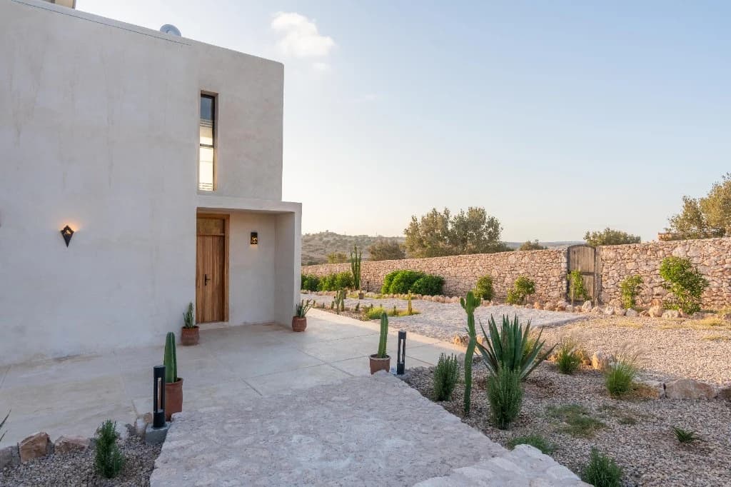 Stay Essaouira villa exterior with Mediterranean garden and olive trees near Essaouira